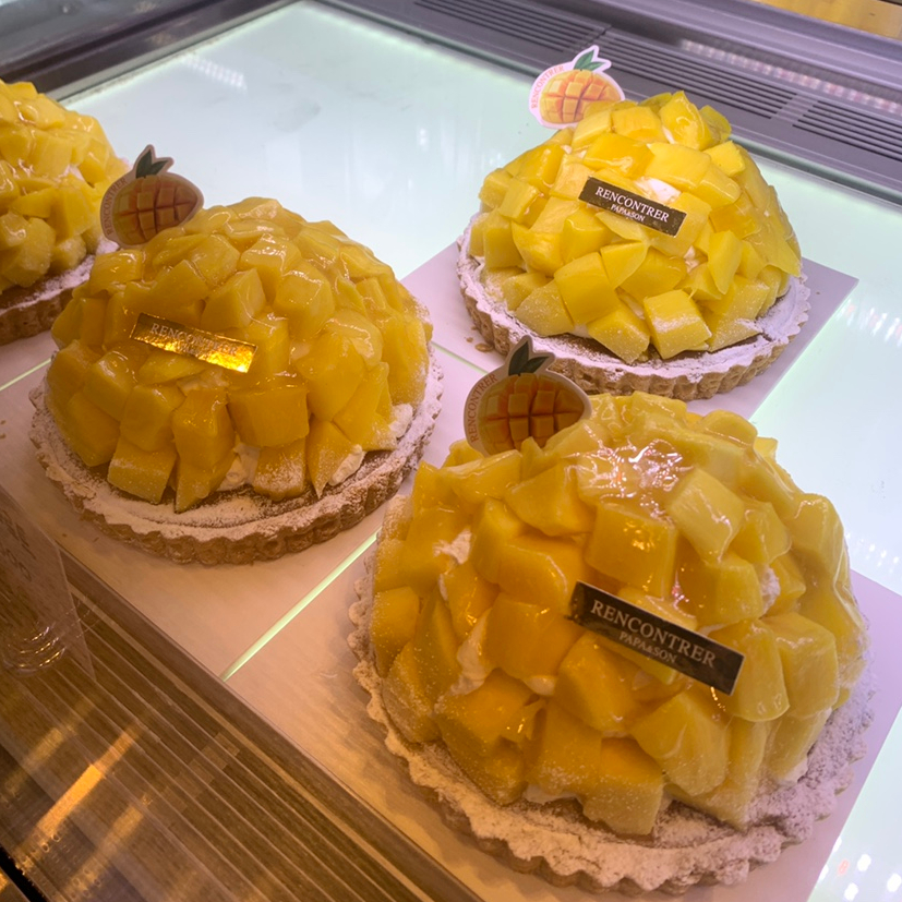 Mango tart cakes with fresh mango topping at Rencontrer Ulsan Bakery display