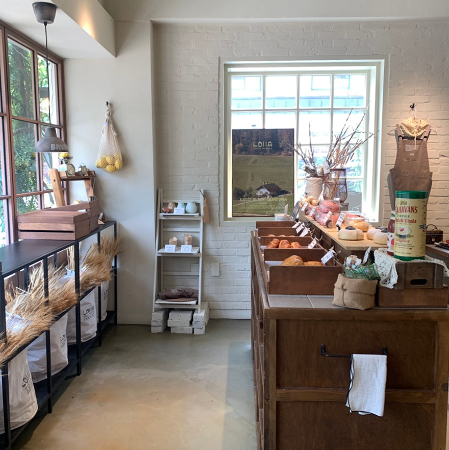 Lola Bakery Daejeon cozy interior bread display wooden shelves and aesthetic bakery counter view
