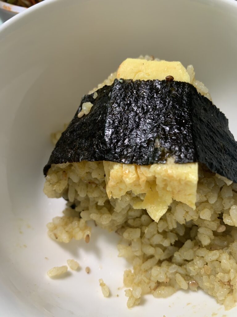 Egg Abalone Rice Ball cross section with rolled egg filling