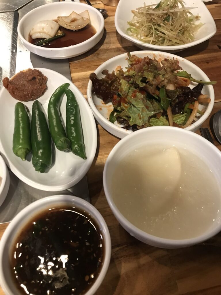 Korean side dishes and soup at Jeonpo Yang Gopchang Busan