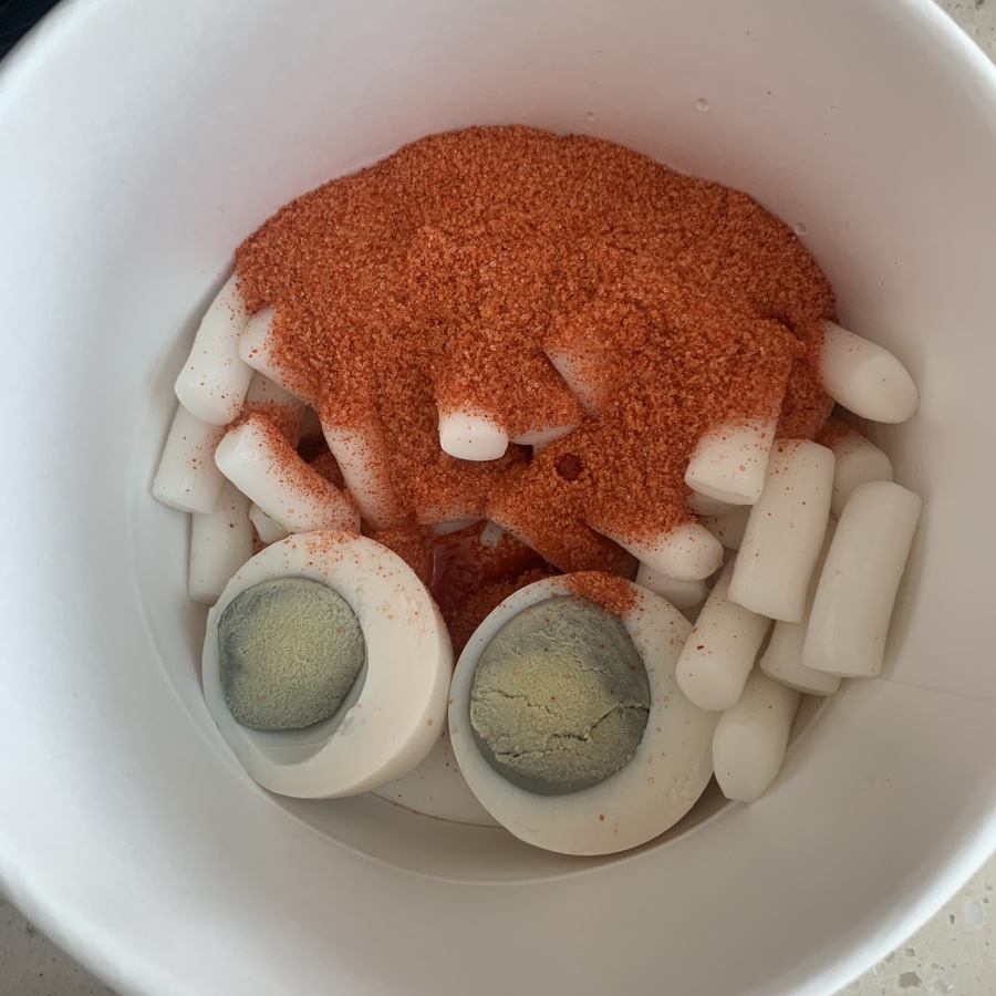Mimi-ne Korean soup tteokbokki with rice cakes seasoning and boiled egg before cooking
