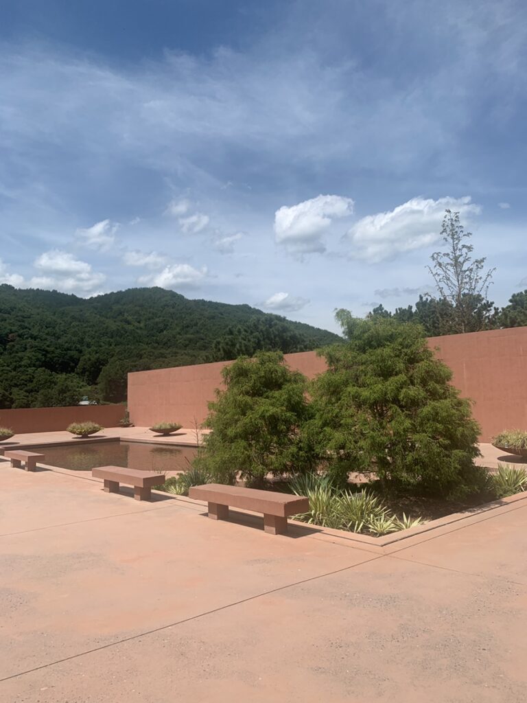 SIHAON Ulsan Cafe garden with terracotta walls and mountain view