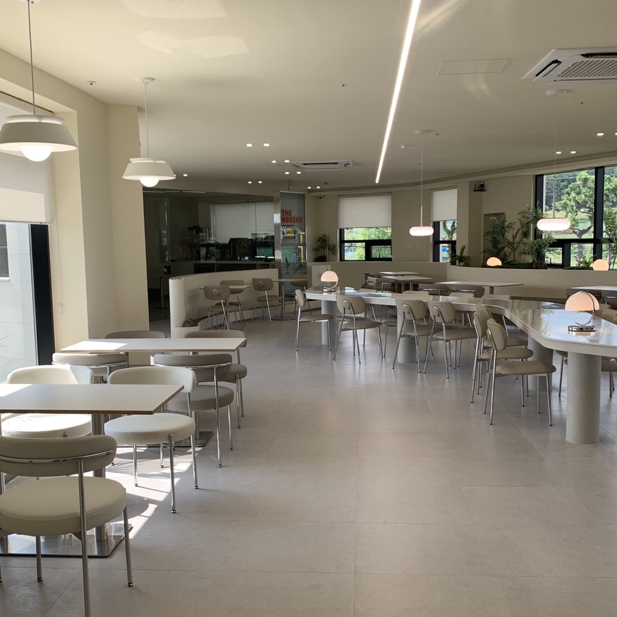 Large seating area at The Woosan Gijang Cafe in Busan