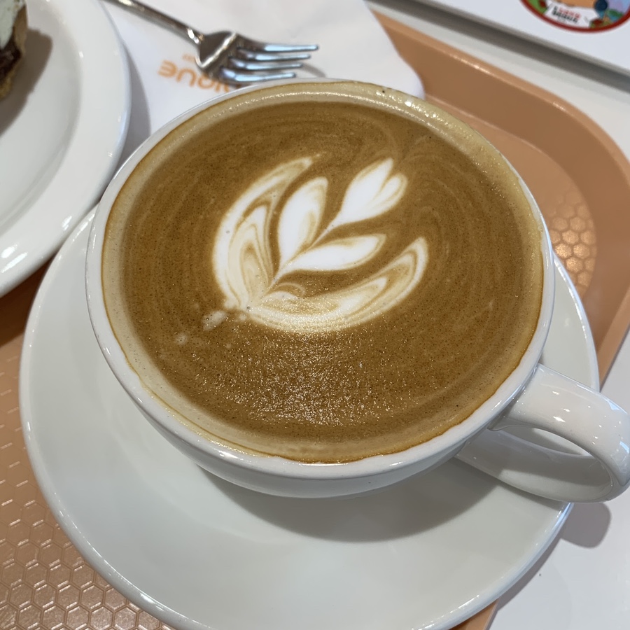 Cafe latte with latte art at Cafe Nudique Segok Seoul