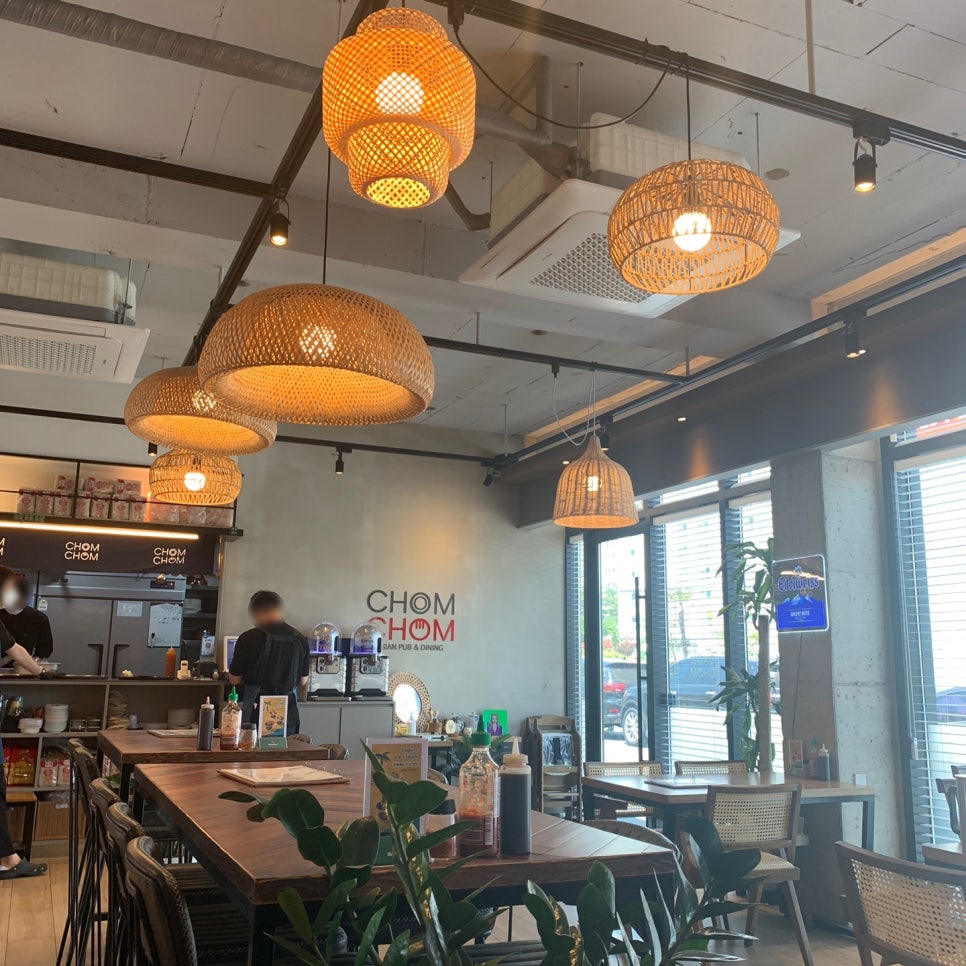 Chom Chom Ulsan Thai Restaurant warm interior with woven pendant lights