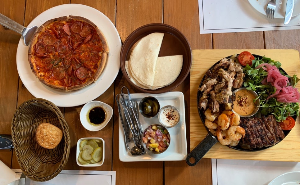 Olivia Deli Hwaseong family meal with pizza grilled platter and tortillas